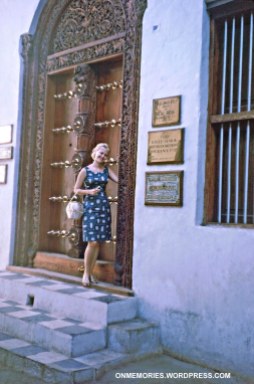Shannon Moeser in front of Zanzibar door, July 6, 1964.